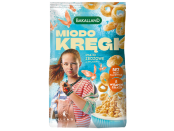 Zdjęcie przedstawia środek spożywczy Bakalland KLEKS Miodo kręgi płatki zbożowe z miodem wzbogacone w witaminy i żelazo.